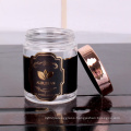 cheap cylinder 200ml glass jar with customized logo round glass jar with rose gold lid